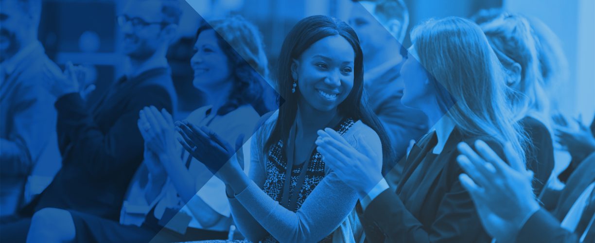 Audience Applauding Speaker After Conference Presentation